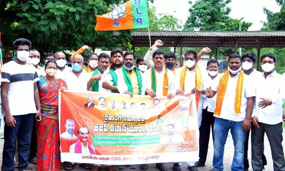 BJP and Kisan Morcha leaders during a rally in Khammam on Monday