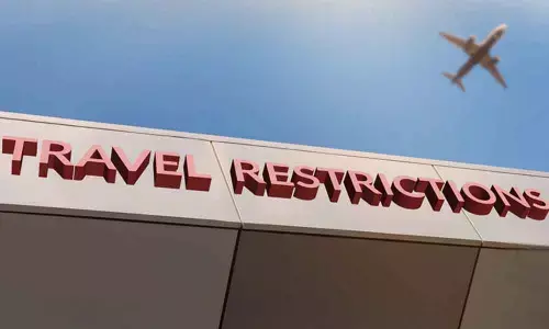 US to keep travel curbs for now