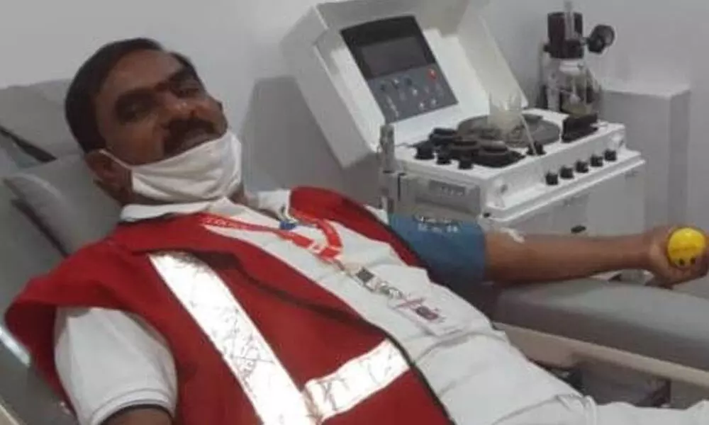 The district chairman of Indian Red Cross Society, Lion Nataraj, donating blood at SVS Medical College Hospital in Mahabubnagar on Wednesday