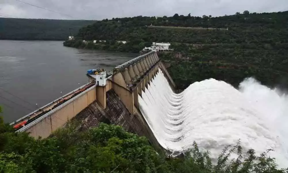 Krishna water being released from Srisailam Dam after lifting 10 crest gates