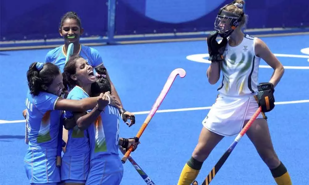 Indian women hockey player Vandana Katariya celebrates after scoring her second goal against South Africa during a womens field hockey match at the 2020 Summer Olympics in Tokyo on Saturday