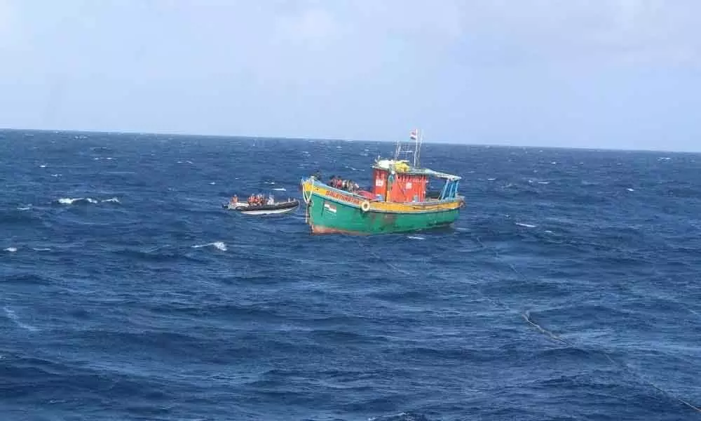 INS Airavat rendering assistance to a fishing boat in distress
