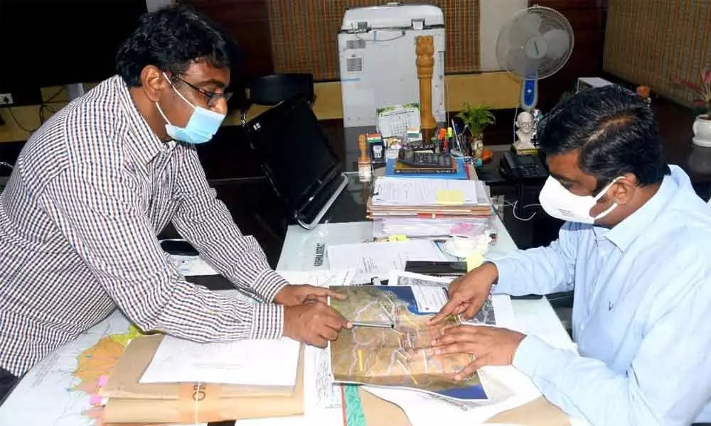 Krishna District Collector J Nivas discussing the flood situation with officials at his camp office in Vijayawada on Saturday