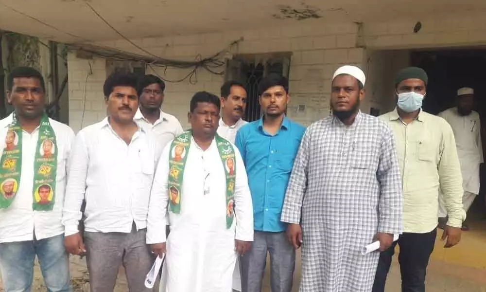 MIM councillors protesting in front of the municipal office in Bodhan on Friday. They allege funds meant for their areas are being diverted to TRS-represented wards