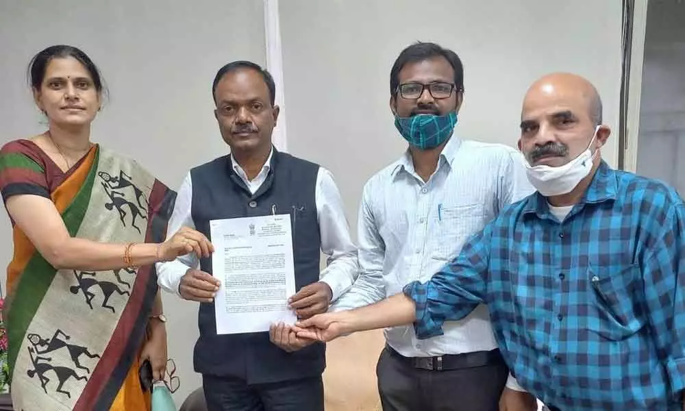 Mohammad Azam (second right), being congratulated for securing the award He is the only person selected for the award from the two Telugu states