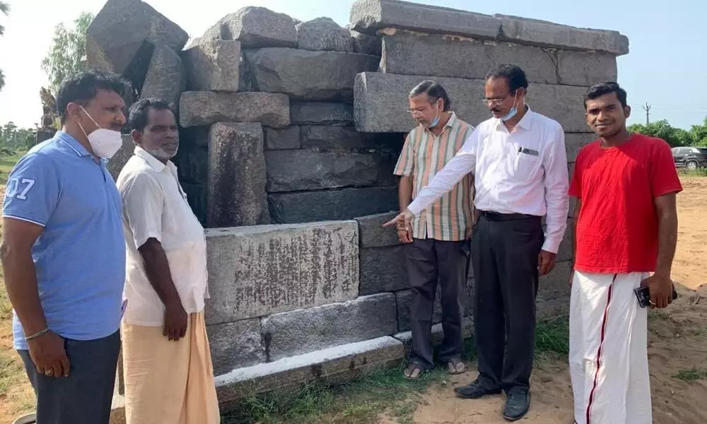 Dr Emani Sivanagi Reddy reading the Tamil inscription at the Kodandarama Swamy temple in Motupalli on Sunday