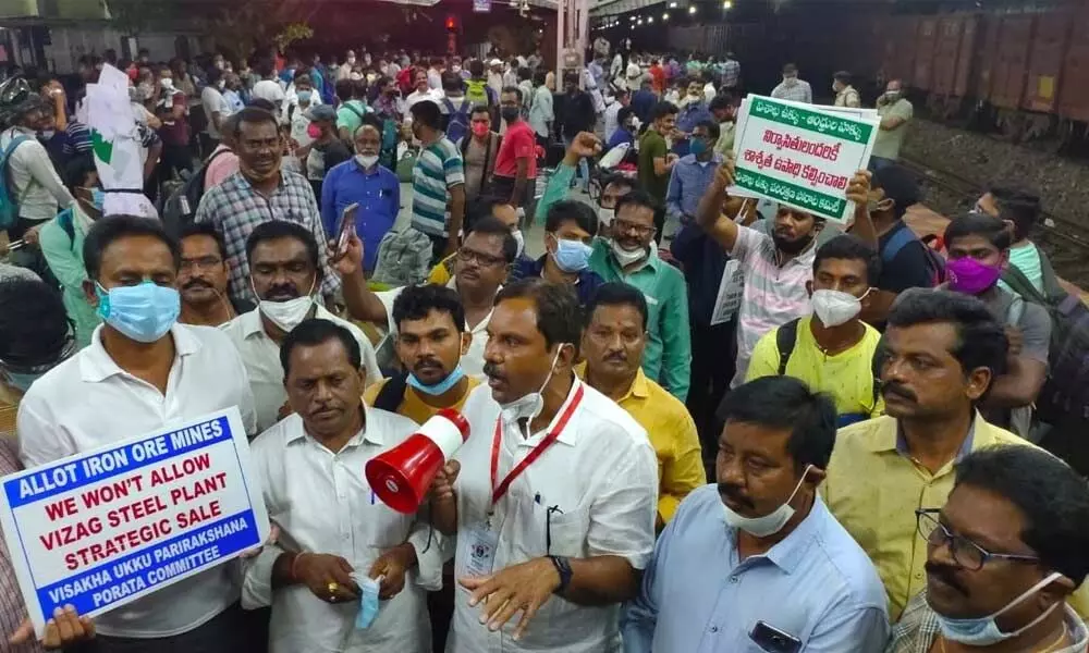 Visakhapatnam Steel Plant employees at railway station in Visakhapatnam on Sunday