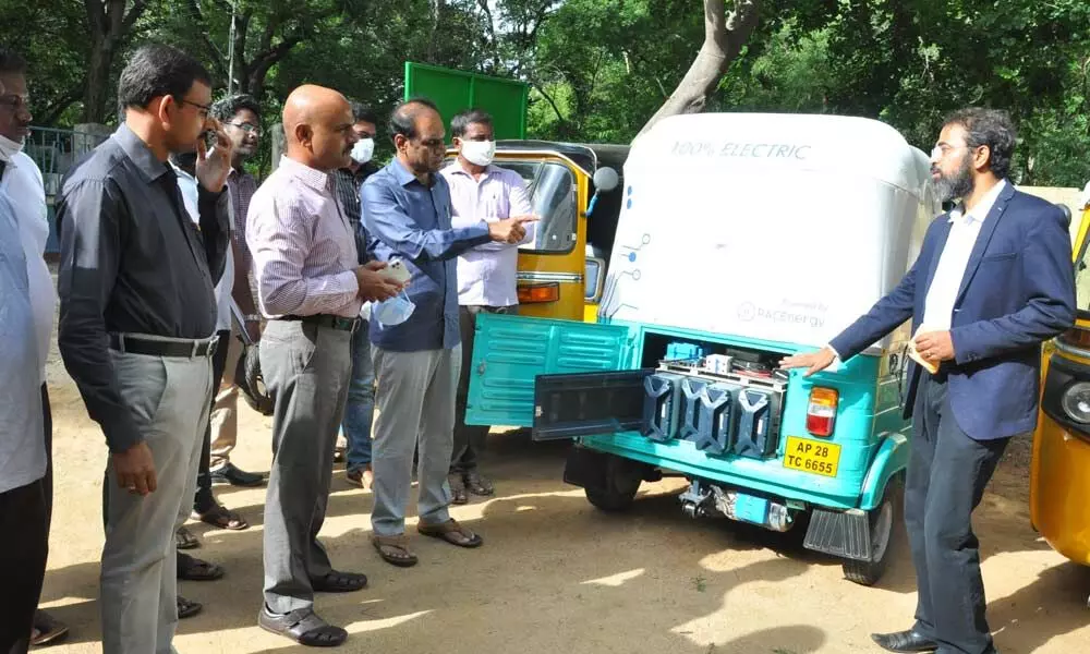 NREDCAP VC & MD S Ramana Reddy, GM CB Jagadeeshwar Reddy and OSD Ramanjaneya Reddy looking at the e-auto rickshaw in Tirupati