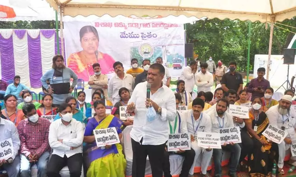 Tourism Minister Muttamsetti Srinivasa Rao speaking at the protest site in Visakhapatnam on Monday