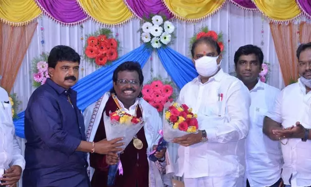 Dr Thomas being felicitated by Minister Perni Nani and MLA Malladi Vishnu in Vijayawada on Monday