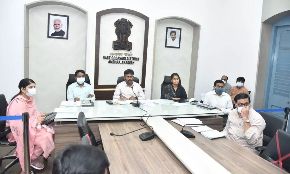 District Collector Chevuri Hari Kiran addressing the review meeting along with Joint Collectors Dr G Lakshmisha, Keerthi Chekuri and G Raja Kumari in Kakinada on Tuesday