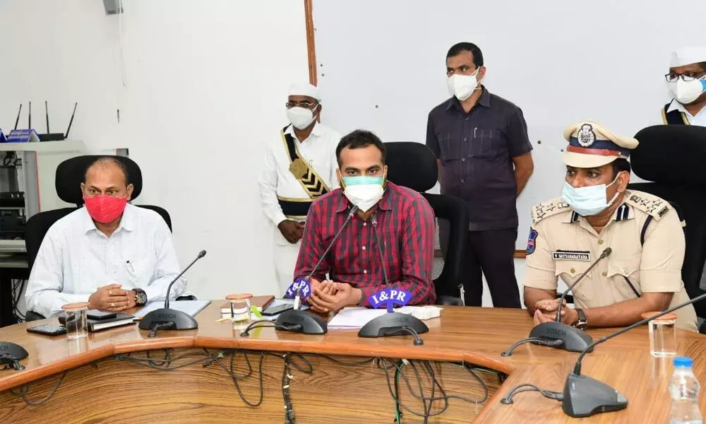 Collector RV Karnan and CPV Satyanarayana addressing a press conference in Karimnagar on Tuesday