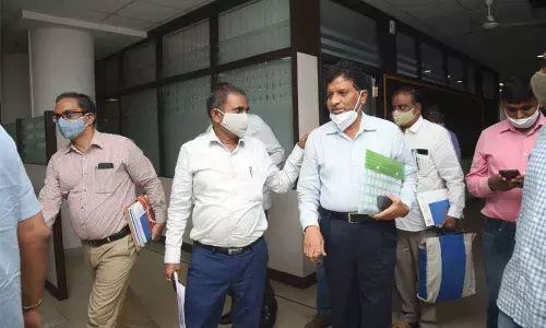 Irrigation officials of Andhra Pradesh make their way to attend Krishna River Management Board at Jalasoudha in Hyderabad on Tuesday. Photo: Adula Krishna