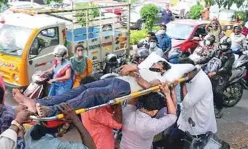 Injured carried on stretcher