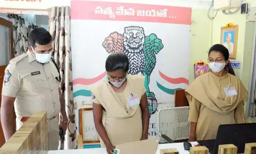 SP Ch Vijaya Rao observing records at Vedayapalem police station in Nellore on Tuesday