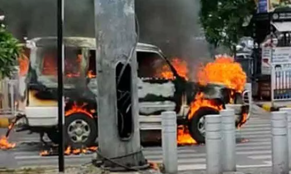 An escort vehicle of police caught on fire on Wednesday here at Khairatabad junction