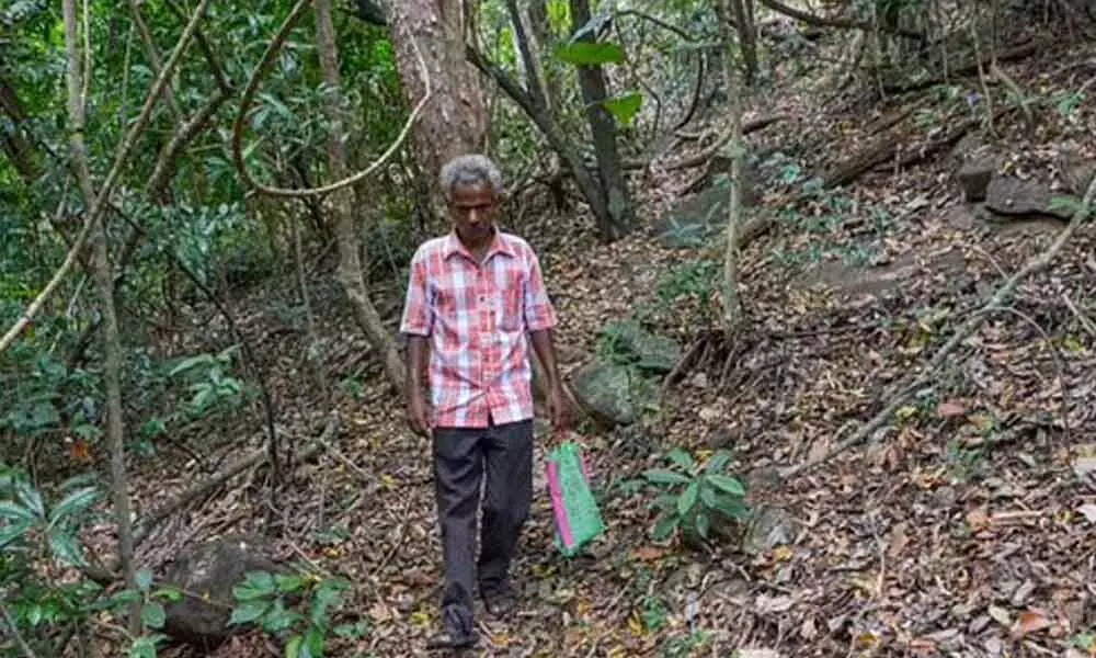 Postmaster Christuraja travels about 15 km to deliver the pension. (Photo | V Karthikalagu, EPS)