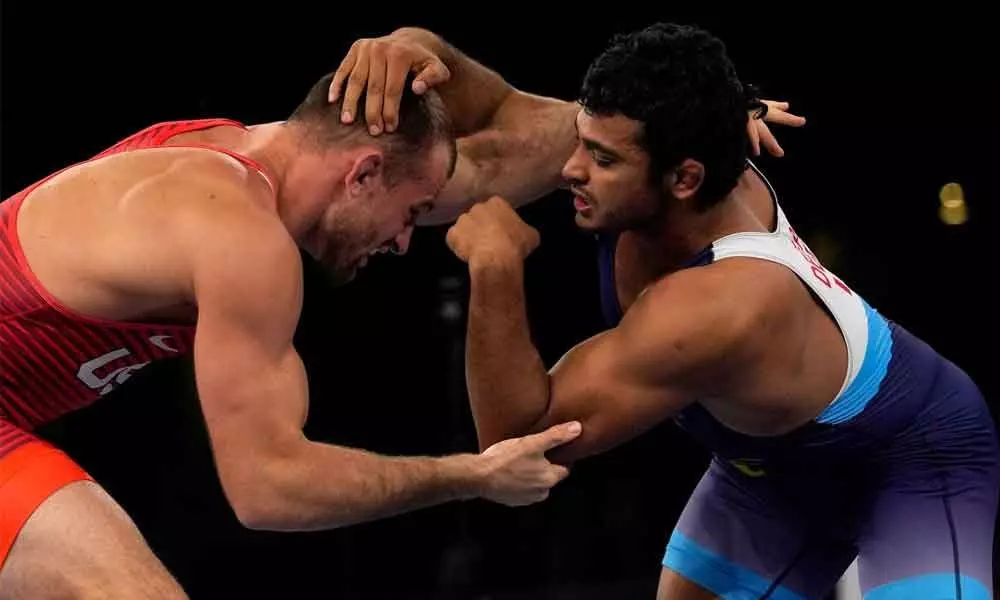 United States David Morris Taylor III, (left) and Indias Deepak Punia compete in the mens 86kg Freestyle semi-final wrestling match at the 2020 Summer Olympics on Wednesday