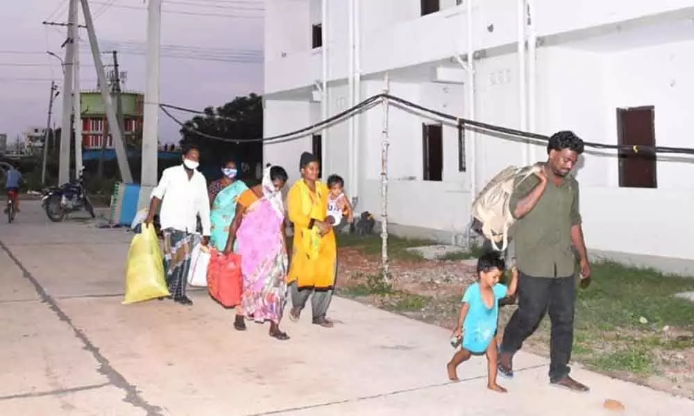 A family arrives at the new house in Ajit Singh Nagar, Vijayawada on Tuesday