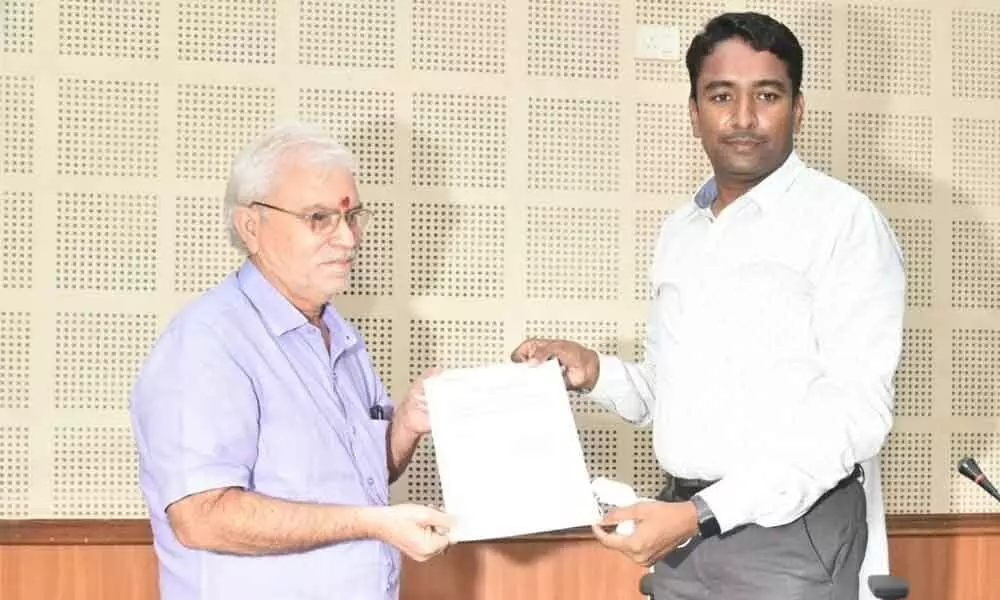 Deputy Mayor Chodipalli Satya Prasad receiving the certificated from the election officer in Kakinada