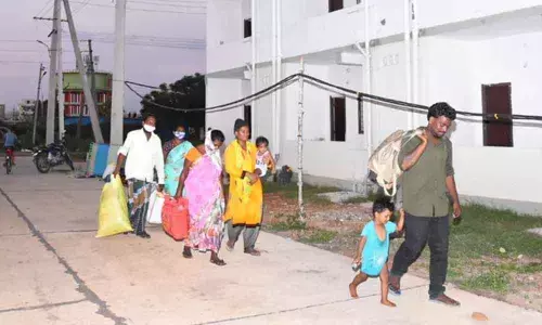 A family arrives at the new house in Ajit Singh Nagar, Vijayawada on Tuesday
