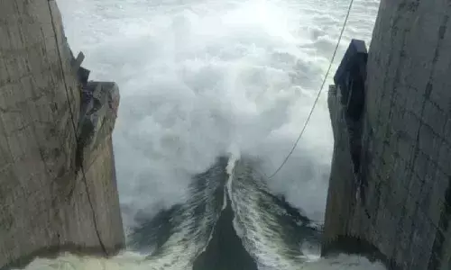 Floodwater gushes out at the broken crest gate No 16 at Pulichintala project  on Thursday