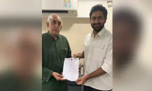 GITAM president M Sribharath handing over an appointment letter to the new Chancellor  Dr Virander Singh Chauhan  in New Delhi