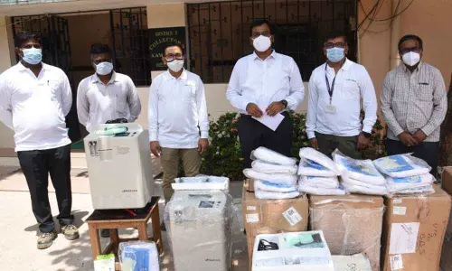 Collector KVN Chakradhar Babu with the representatives of Siemens Gamesa in connection with donation of Rs 13 lakh worth medical equipment, in Nellore on Thursday