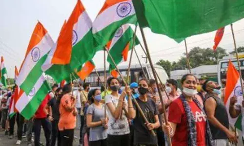 Bharatiya Janata Yuva Morcha members take part in a Tiranga Marathon on the occasion of the 2nd anniversary of abrogation of Article 370 and bifurcation of J&K