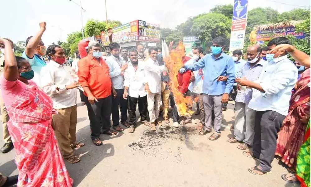 Protesters burn an effigy of Union Finance Minister Nirmala Sitharaman in Visakhapatnam on Saturday
