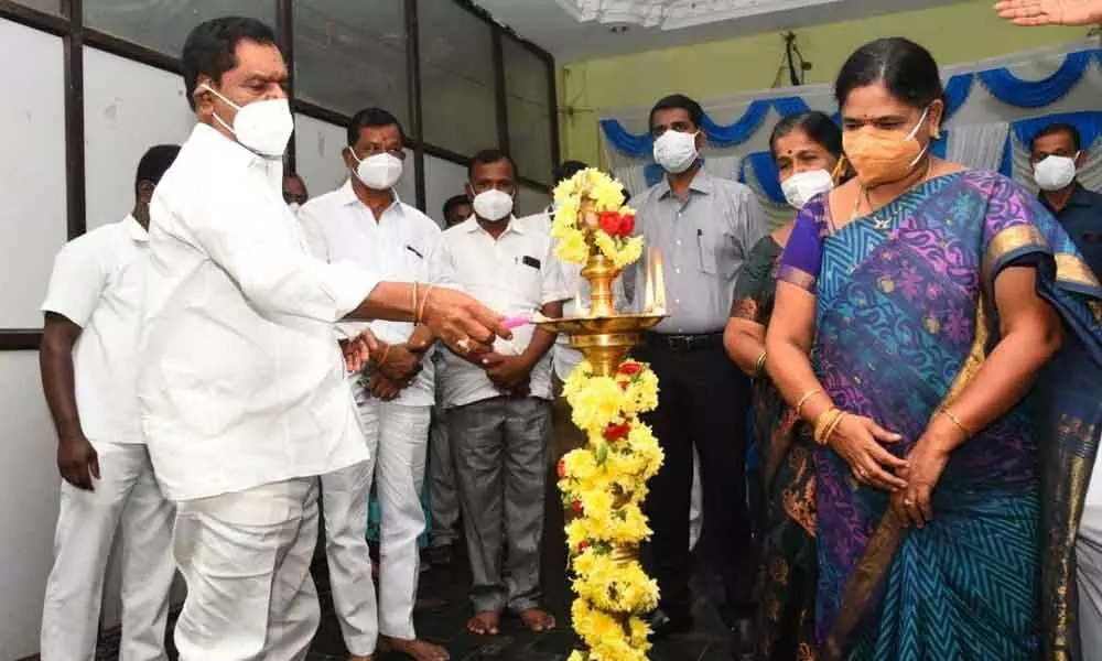 Deputy Chief Minister K Narayana Swamy lighting the lamp to mark the inauguration of World Adivasi Day festival in Chittoor on Monday