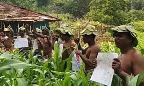 Tribals staging a protest demanding minimum amenities in Agency areas in Visakhapatnamon Monday
