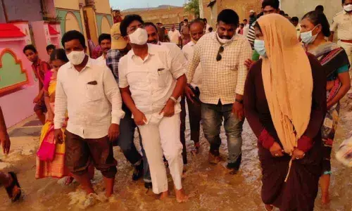 Education Minister Dr Audimulapu Suresh inspecting the condition of Indira Nagar in Dornala on Monday