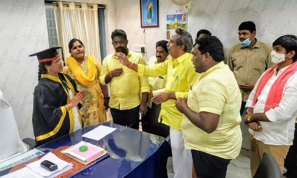 TDP and Janasena corproators demanding the Mayor not to implement property value based assessments in Ongole on Tuesday