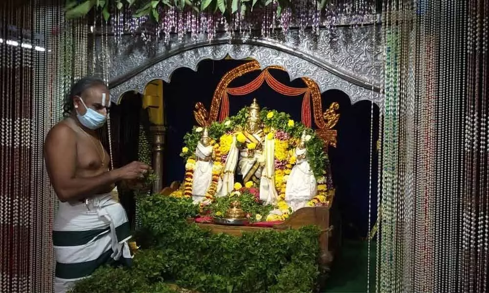 A priest performing Sahasranamarchana at Sri Varaha Lakshmi Narasimha Swamy temple in Visakhapatnam on Tuesday