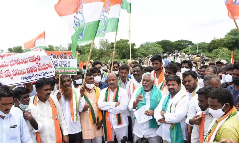 MLC T Jeevan Reddy and BJP leaders staged a dharna in Gangadhara mandal in Karimnagar district on Tuesday