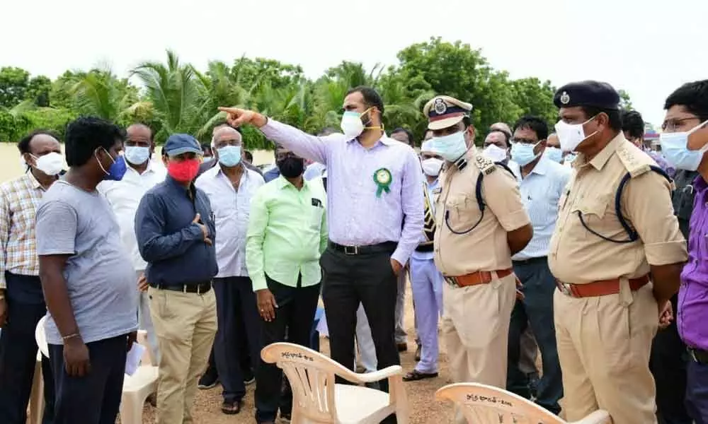 Collector RV Karnan and CP V Satyanarayana inspecting arrangements for the Chief Ministers visit to Shalapalli village in Huzurabad mandal in Karimnagar district on Tuesday