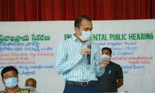 District Collector Prashanth Jeevan Patil addressing the participants during the public hearing of PRLIS at Konda Mallepally on Tuesday