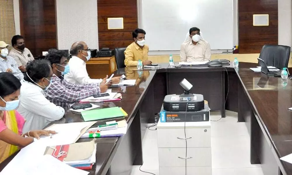 District Collector J Nivas reviewing the progress in shifting the offices from Swaraj Maidan in Vijayawada on Wednesday