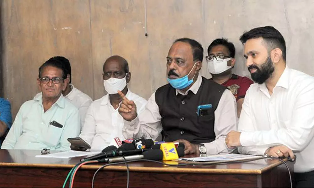 Bengal Chamber of Commerce & Industry Secretary Utpal Roy and others addressing a press conference in Vijayawada on Wednesday