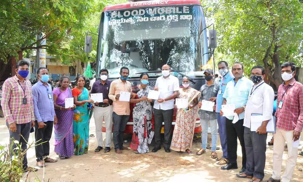 SHG women and Ruia staff at a blood donation camp at RASS building in Tirupati on Wednesday