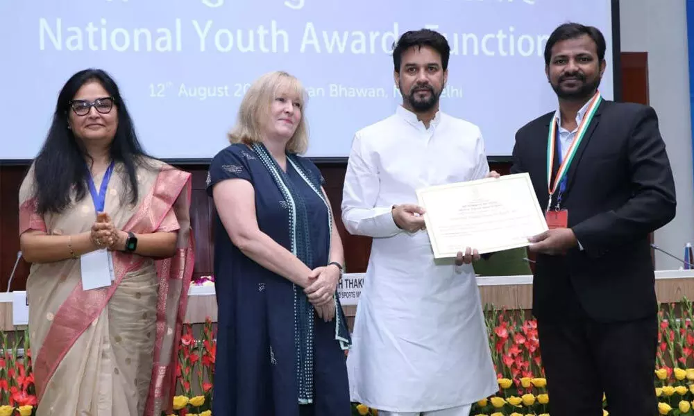 Mohammad Azam receiving National Youth Award from Union Minister for Sports and Youth Affairs Anurag Thakur in New Delhi on Thursday.