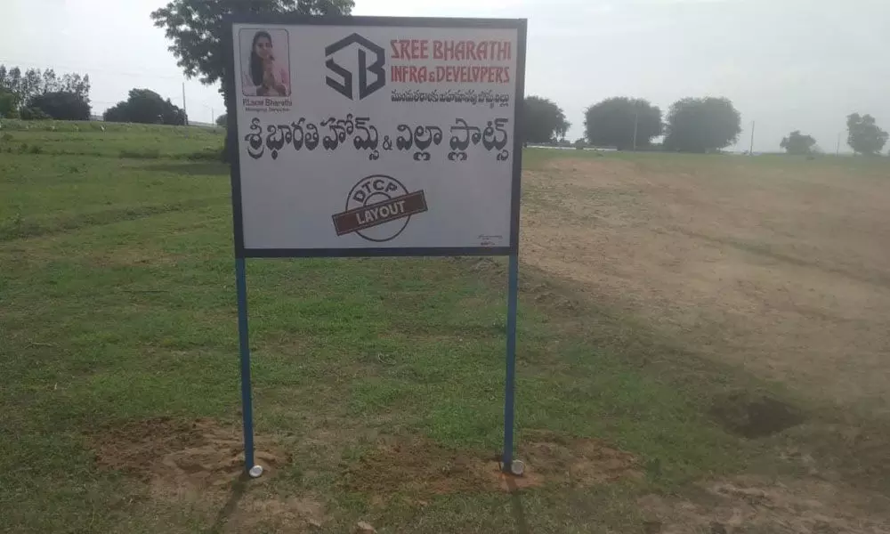 Sri Bharati Infra & Developers board in Shagapur village