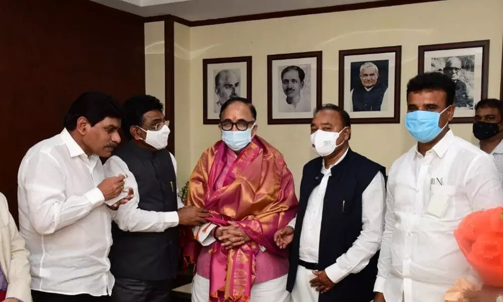TRS Lok Sabha floor leader and MP Nama Nageswara Rao and TRS MPs, MLAs and HMT workers with Union Minister for Heavy Industries Mahendranath Pandey in New Delhi