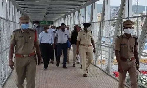 DRM K Venkataramana Reddy visiting Tirupati railway station on Thursday. Station Director K Satyanarayana is also seen.