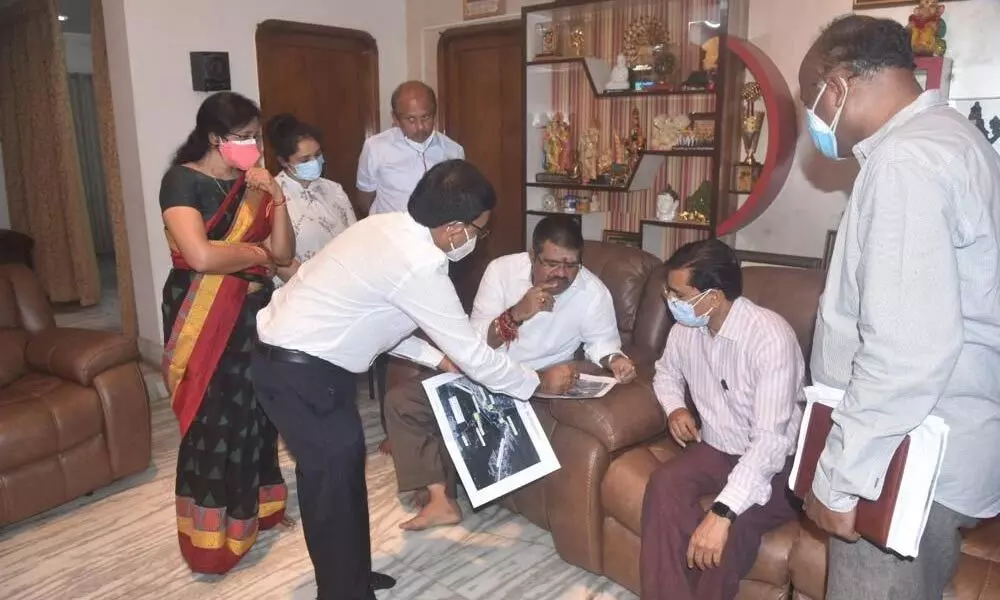 Tourism Minister M Srinivasa Rao and Union Tourism Department officials discuss the PRASAD scheme in Visakhapatnam on Friday