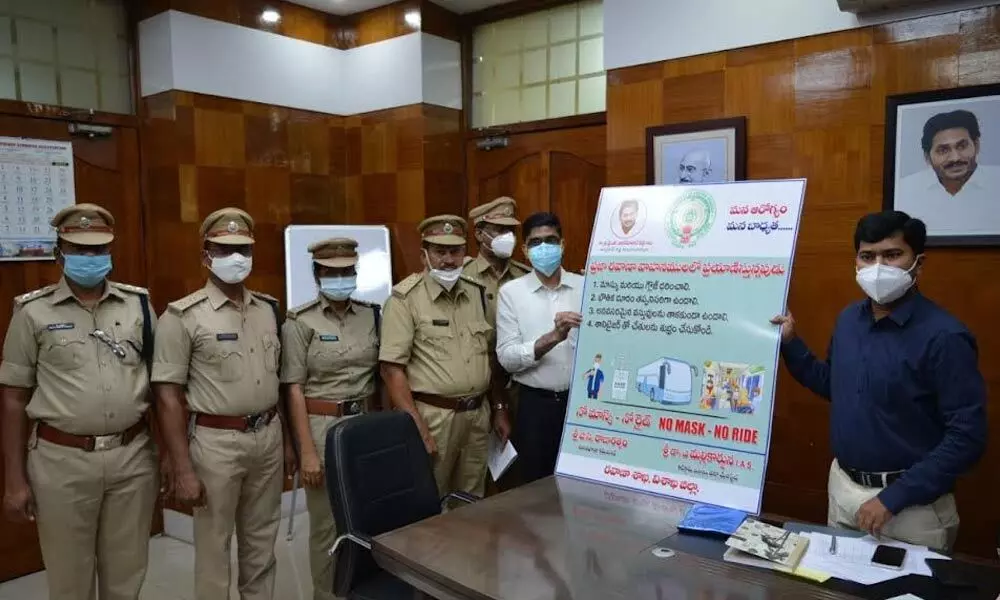 District Collector A Mallikarjuna and RTA officials launching posters of the 27-day-long ‘No Mask - No Ride’ drive in Visakhapatnam on Friday