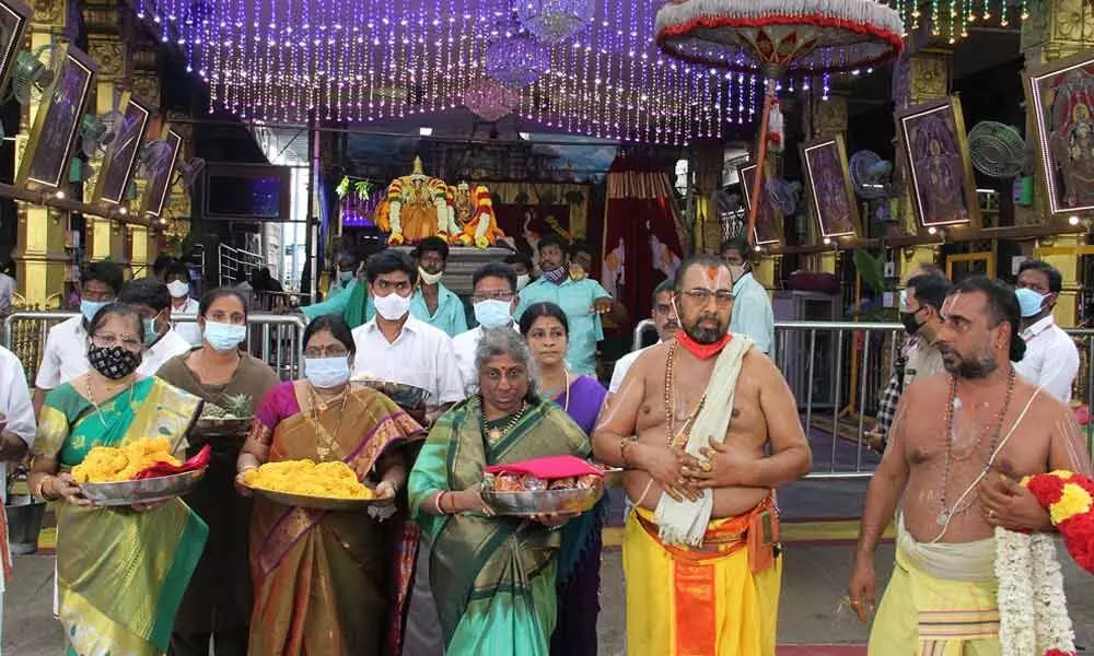 Temple officials and priests carrying the Varalakshmi Vratham pooja material during a Pradakshinam at Tiruchanur temple on Friday