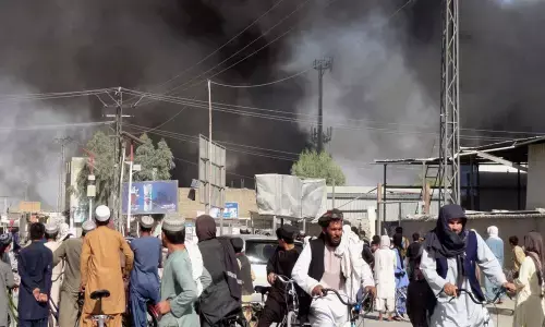 Smoke rises after fighting between the Taliban and the Afghan security personnel in Kandahar, southwest of Kabul, on Thursday