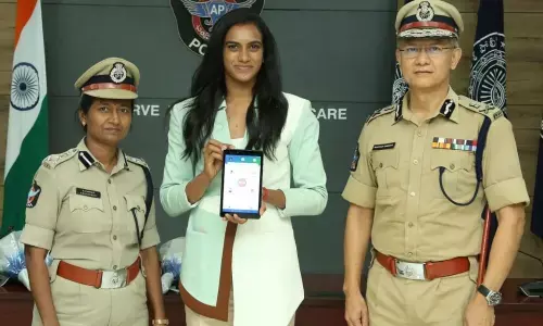 Director-General of Police Gautam D Sawang felicitating bronze medal winner in Olympics PV Sindhu on Friday
